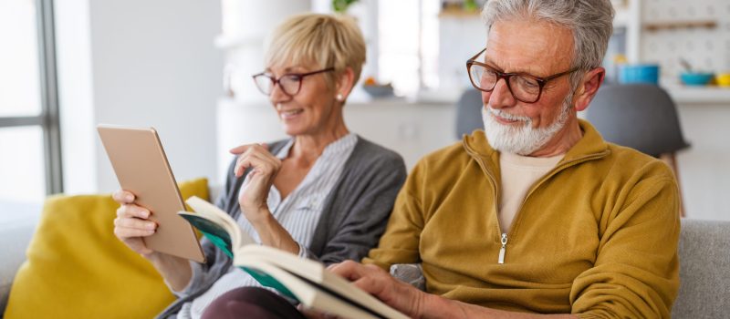 Cheerful happy senior couple enjoying retired life at home